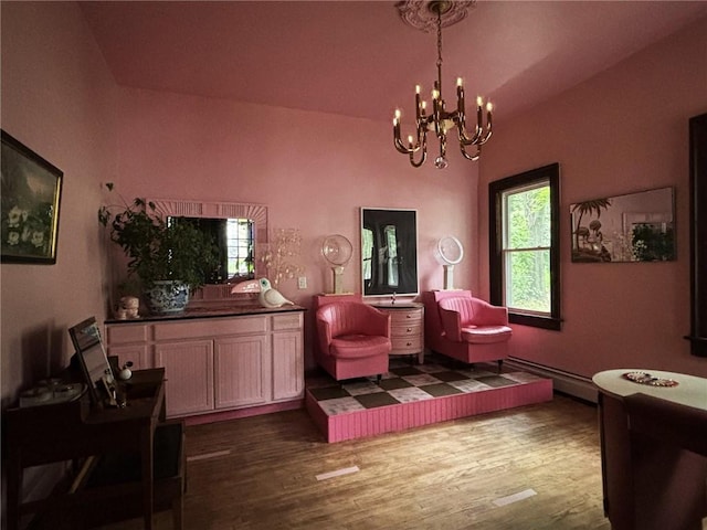 35799 State Highway 10, Hamden, NY 13782 - living area featuring a chandelier, wood finished floors, baseboard heating, and lofted ceiling