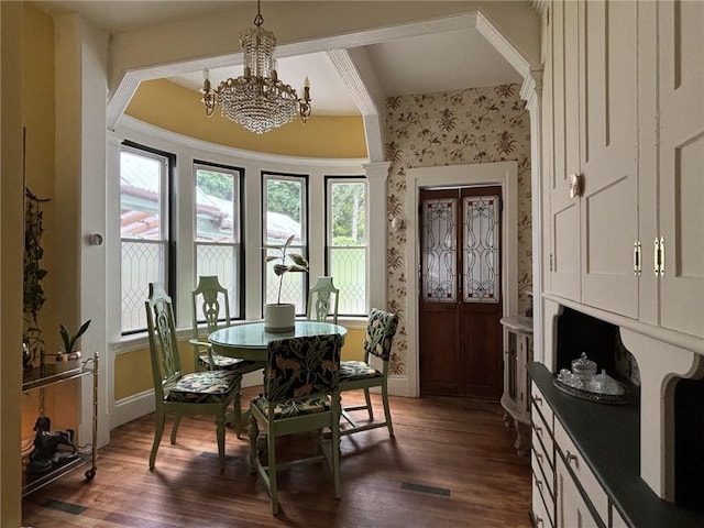 35799 State Highway 10, Hamden, NY 13782 - dining room featuring wallpapered walls, healthy amount of natural light, dark wood finished floors, and a chandelier