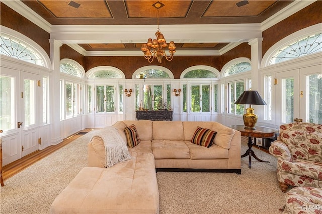 71 Forman St, Cazenovia, NY 13035 - sunroom / solarium with french doors, a chandelier, crown molding, a towering ceiling, and carpet flooring