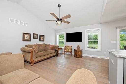61 Kirkdale Cir, Greece, NY 14612 - living room with lofted ceiling, light wood-style floors, and a ceiling fan
