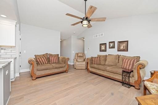 61 Kirkdale Cir, Greece, NY 14612 - living area with lofted ceiling, a ceiling fan, and light wood-style floors