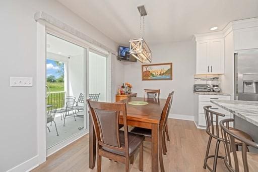 61 Kirkdale Cir, Greece, NY 14612 - dining room featuring light wood-style floors and a chandelier