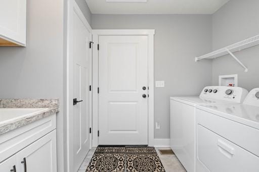 61 Kirkdale Cir, Greece, NY 14612 - laundry room with independent washer and dryer, cabinet space, and light tile patterned floors