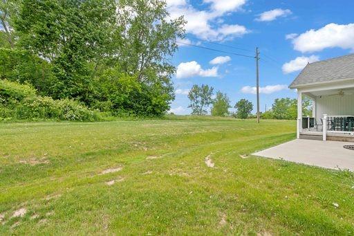61 Kirkdale Cir, Greece, NY 14612 - view of grassy yard with a patio