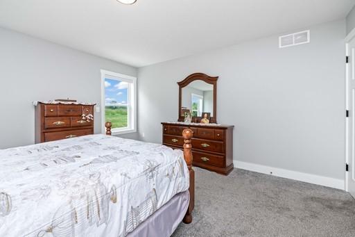 61 Kirkdale Cir, Greece, NY 14612 - carpeted bedroom with baseboards