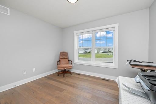 61 Kirkdale Cir, Greece, NY 14612 - sitting room with baseboards and wood finished floors