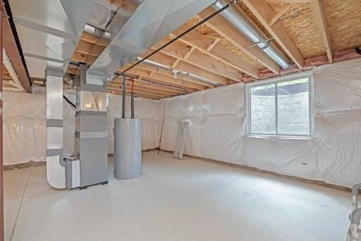 61 Kirkdale Cir, Greece, NY 14612 - below grade area featuring water heater and heating unit