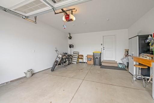61 Kirkdale Cir, Greece, NY 14612 - garage with a garage door opener