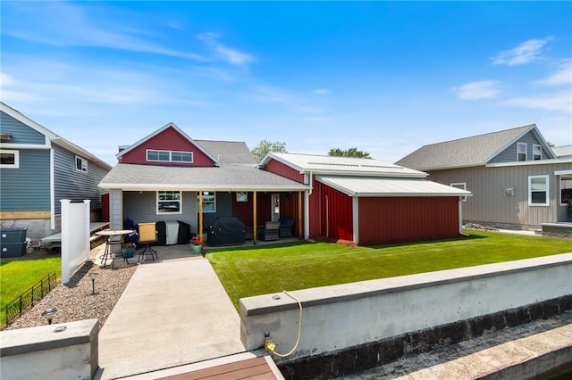 8545 Greig St, Sodus, NY 14555 - back of property with roof with shingles and a patio area