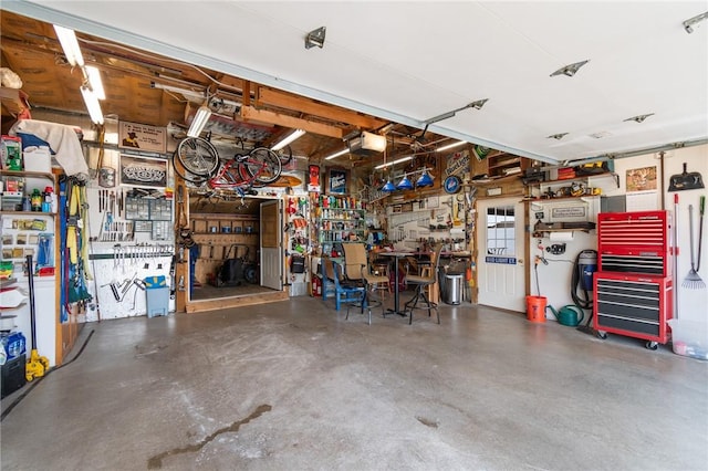 8545 Greig St, Sodus, NY 14555 - garage with a workshop area and a garage door opener