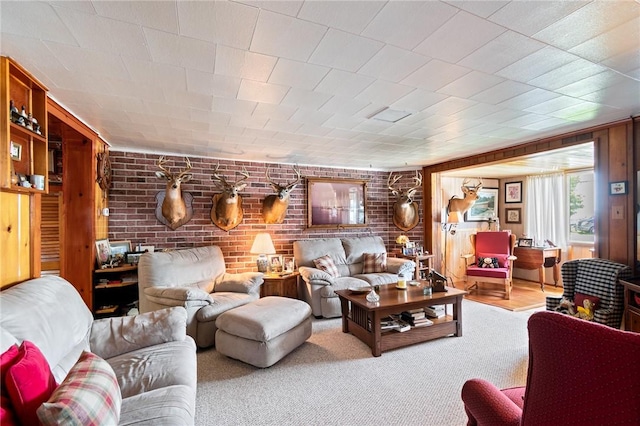 8545 Greig St, Sodus, NY 14555 - living room with brick wall and carpet floors