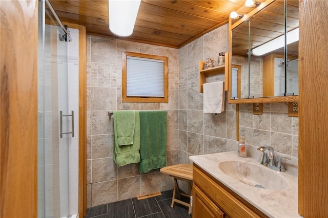 8545 Greig St, Sodus, NY 14555 - bathroom featuring wood ceiling, vanity, a shower stall, and tile walls