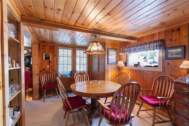 8545 Greig St, Sodus, NY 14555 - dining room featuring a wooden ceiling with exposed beams, wood walls, and carpet flooring