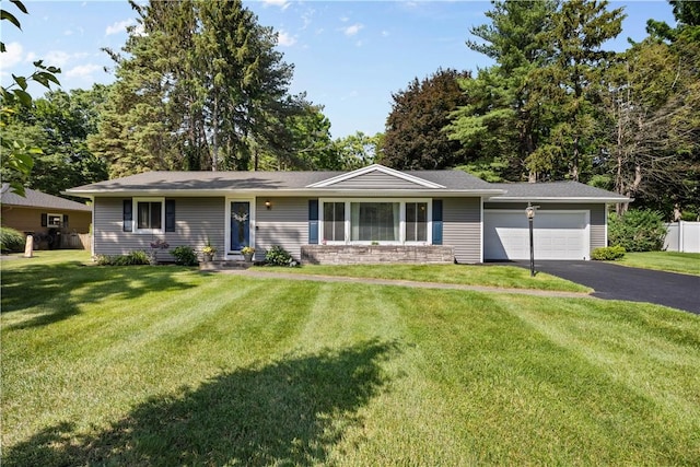 16 Trowbridge Trl, Pittsford, NY 14534 - single story home featuring an attached garage, asphalt driveway, a front lawn, and entry steps