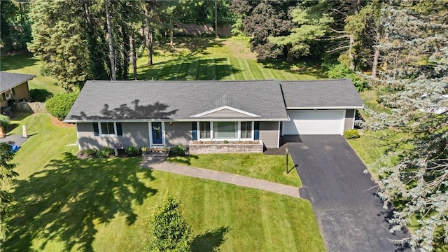 16 Trowbridge Trl, Pittsford, NY 14534 - ranch-style house with asphalt driveway, a garage, and a front lawn