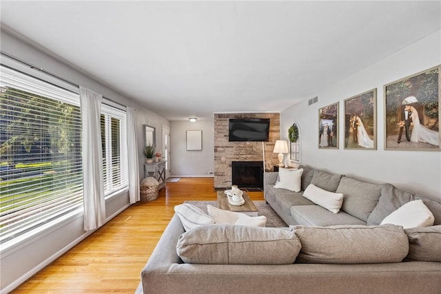 16 Trowbridge Trl, Pittsford, NY 14534 - living area with light wood finished floors and a fireplace
