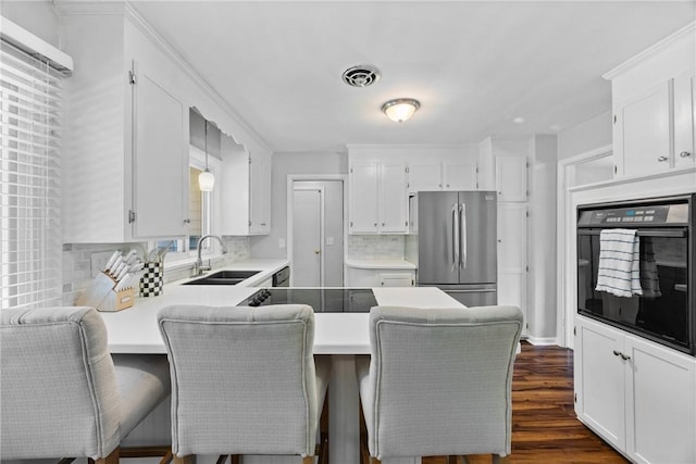 16 Trowbridge Trl, Pittsford, NY 14534 - kitchen featuring black appliances, a peninsula, tasteful backsplash, and white cabinets