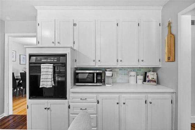 16 Trowbridge Trl, Pittsford, NY 14534 - kitchen with oven, stainless steel microwave, white cabinets, and light countertops