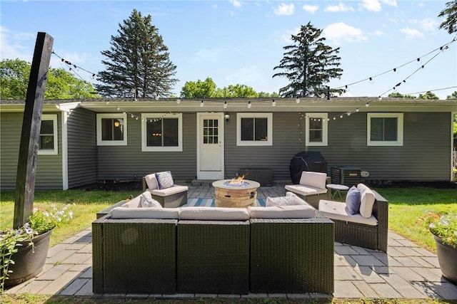 16 Trowbridge Trl, Pittsford, NY 14534 - back of property with an outdoor living space with a fire pit and a patio