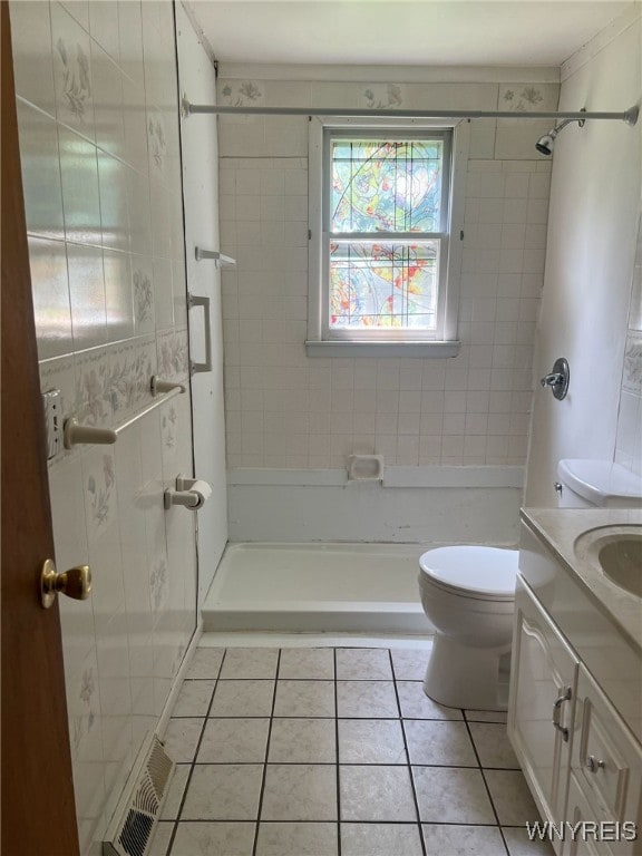 3980 Ridgelea Dr, Newfane, NY 14094 - bathroom with tile patterned floors, vanity, and a shower