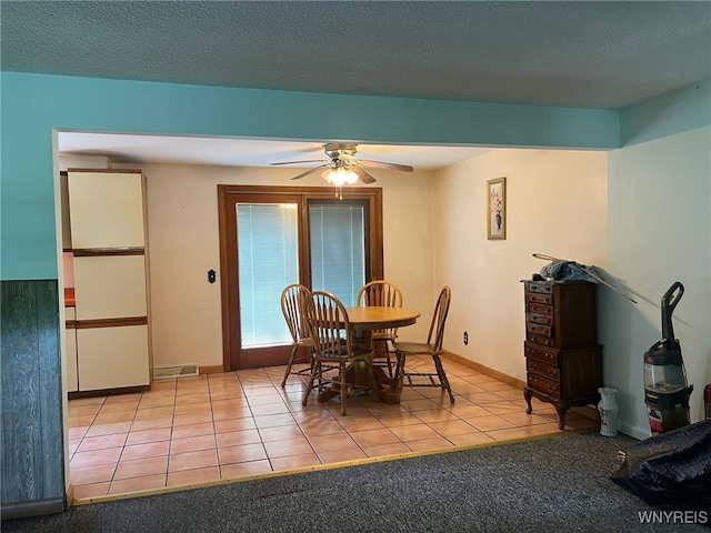 3980 Ridgelea Dr, Newfane, NY 14094 - dining area featuring tile patterned floors, ceiling fan, and a textured ceiling