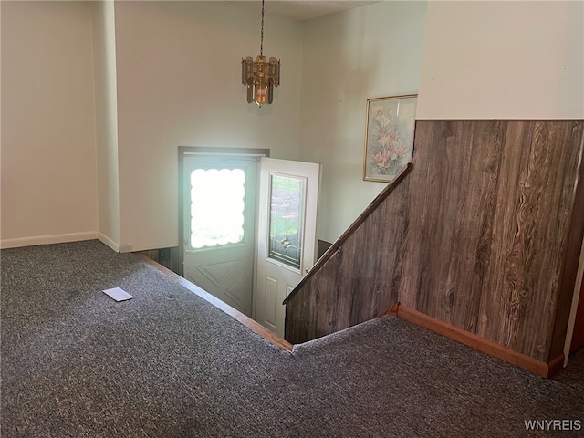 3980 Ridgelea Dr, Newfane, NY 14094 - stairway featuring carpet and a chandelier