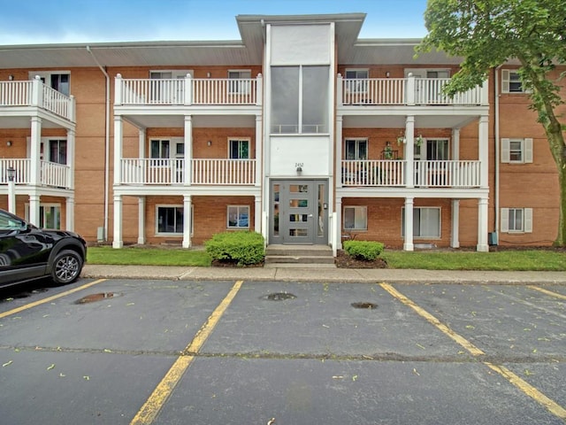 2432 E Ave Unit B, Brighton, NY 14610 - view of building exterior featuring uncovered parking