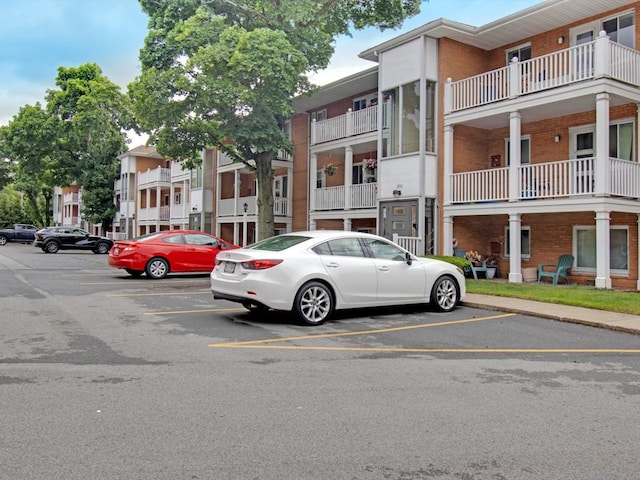 2432 E Ave Unit B, Brighton, NY 14610 - view of building exterior featuring uncovered parking