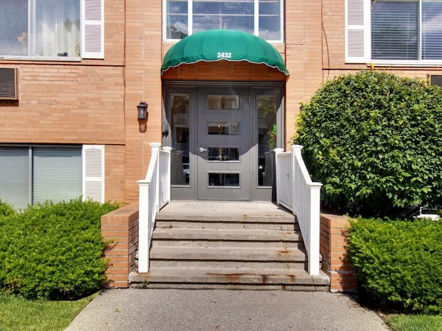 2432 E Ave Unit B, Brighton, NY 14610 - doorway to property with brick siding