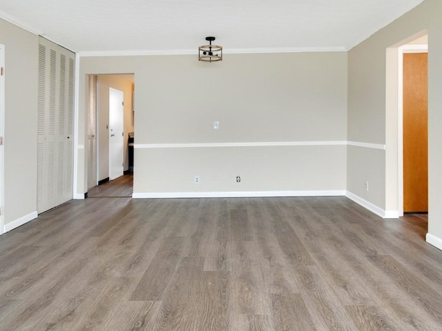 2432 E Ave Unit B, Brighton, NY 14610 - unfurnished room featuring crown molding and wood finished floors