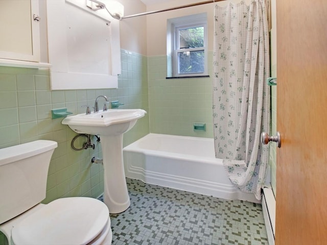 2432 E Ave Unit B, Brighton, NY 14610 - full bath featuring tile patterned floors, shower / tub combo, tile walls, and wainscoting