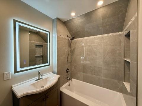 41 Garnet St, Rochester, NY 14609 - bathroom featuring vanity, bathing tub / shower combination, and recessed lighting