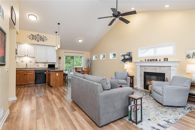 3919 N Park Way, Walworth, NY 14568 - living room featuring light wood-style floors, high vaulted ceiling, a tiled fireplace, a ceiling fan, and recessed lighting