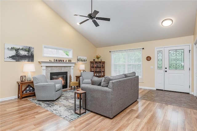 3919 N Park Way, Walworth, NY 14568 - living room with high vaulted ceiling, wood finished floors, a tiled fireplace, and ceiling fan
