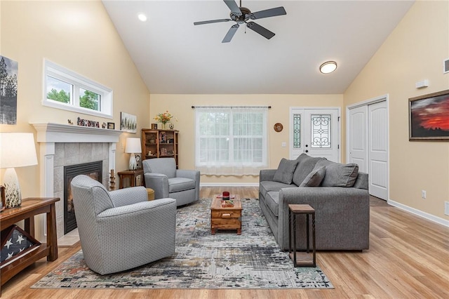 3919 N Park Way, Walworth, NY 14568 - living room with high vaulted ceiling, wood finished floors, ceiling fan, a tiled fireplace, and recessed lighting