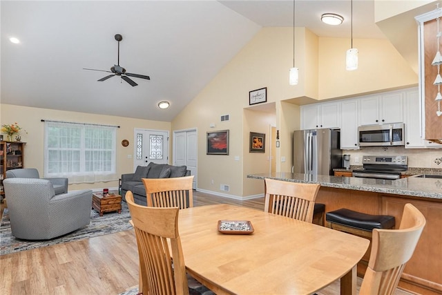 3919 N Park Way, Walworth, NY 14568 - dining area featuring high vaulted ceiling, ceiling fan, and light wood finished floors