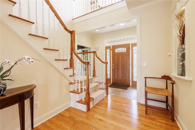 4 Crowne Pointe Dr, Penfield, NY 14526 - entrance foyer with wood finished floors, ornamental molding, and stairs