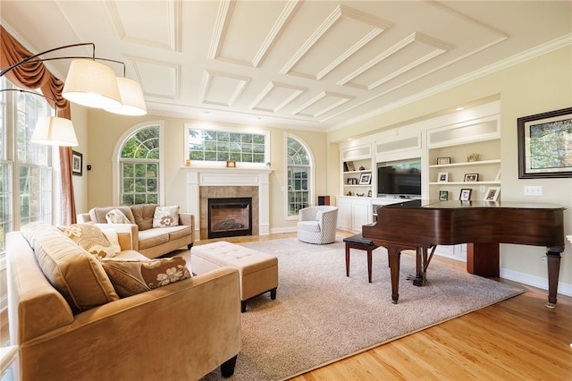 4 Crowne Pointe Dr, Penfield, NY 14526 - living room with light wood-style flooring, a tiled fireplace, built in features, and ornamental molding