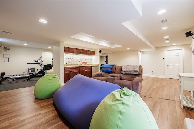 4 Crowne Pointe Dr, Penfield, NY 14526 - living area with light wood-style flooring, wet bar, and recessed lighting