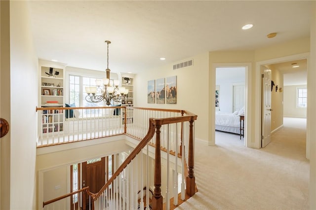 4 Crowne Pointe Dr, Penfield, NY 14526 - hall with an upstairs landing, a chandelier, carpet flooring, and recessed lighting