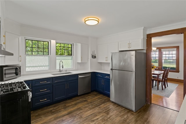 29 Stonehenge Rd, Irondequoit, NY 14609 - kitchen with appliances with stainless steel finishes, blue cabinetry, light countertops, white cabinetry, and ornamental molding