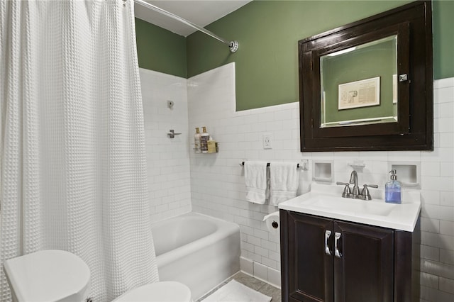 29 Stonehenge Rd, Irondequoit, NY 14609 - full bathroom with tile walls, vanity, and shower / tub combo