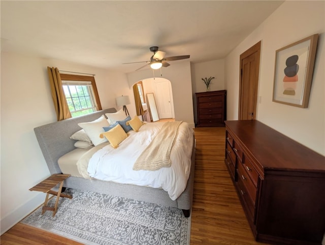 29 Stonehenge Rd, Irondequoit, NY 14609 - bedroom featuring wood finished floors, arched walkways, and a ceiling fan