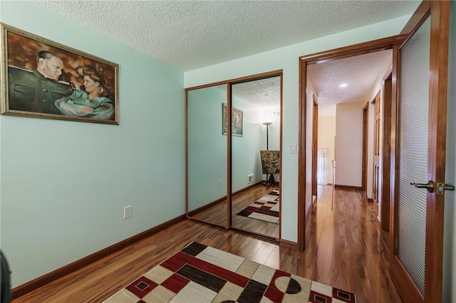18 Chesterton Ct, Perinton, NY 14450 - unfurnished bedroom with a textured ceiling, wood finished floors, and a closet