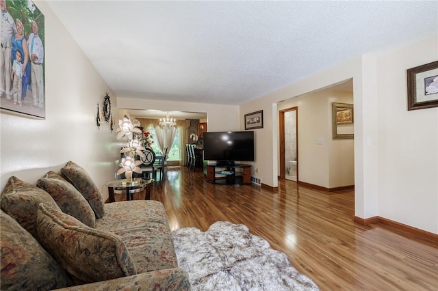 18 Chesterton Ct, Perinton, NY 14450 - living room with a chandelier and wood finished floors