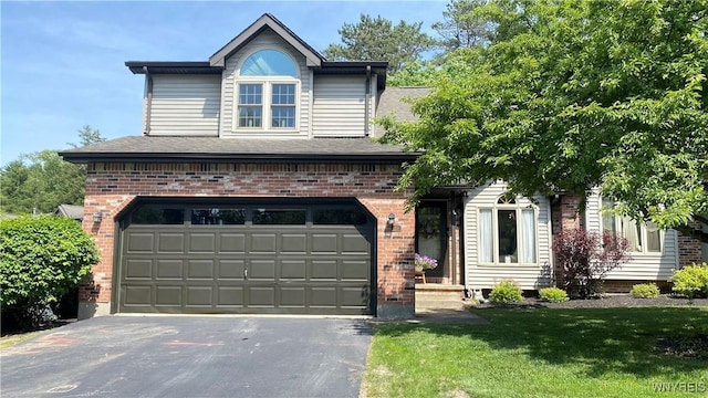 20 In The Woods Ln, West Seneca, NY 14224 - view of front facade with driveway, brick siding, an attached garage, a front yard, and a shingled roof