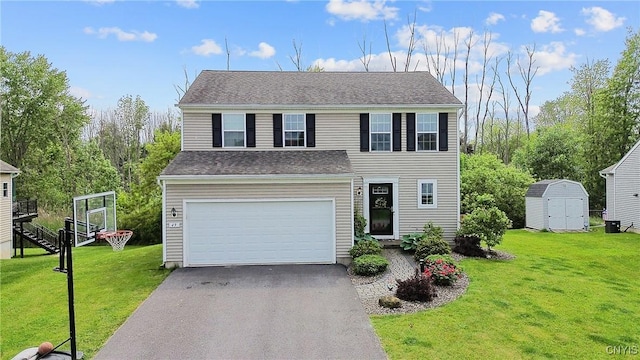 49 Silversides Way, Van Buren, NY 13027 - view of front facade featuring a storage shed, driveway, a garage, and a front yard
