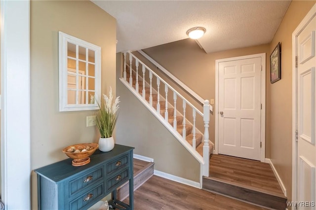 278 Shady Grove Dr, Amherst, NY 14051 - stairway with wood finished floors and a textured ceiling