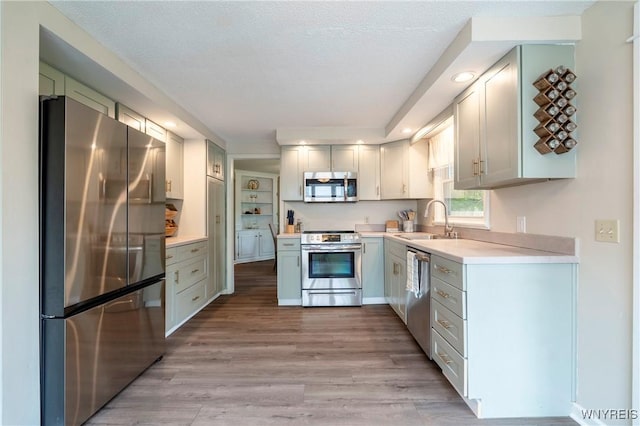 278 Shady Grove Dr, Amherst, NY 14051 - kitchen with stainless steel appliances, light countertops, light wood finished floors, and recessed lighting