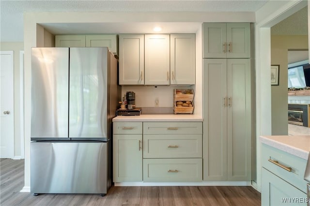 278 Shady Grove Dr, Amherst, NY 14051 - kitchen with freestanding refrigerator, light wood-style flooring, and light countertops